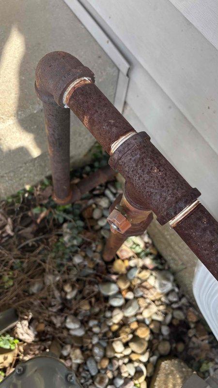 Conducted a generator installation estimate at residential property, noting severely corroded gas piping that will require replacement prior to generator installation. Observed existing gas meter configuration and documented current plumbing conditions to incorporate necessary repairs into comprehensive generator installation proposal.