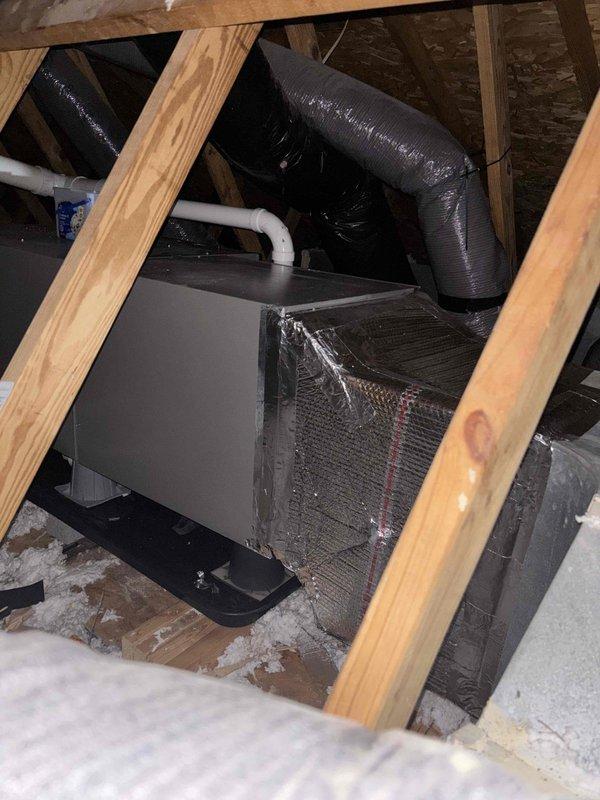 Completed Platinum Level maintenance service on HVAC system located in attic space. Inspected unit condition, connections, and ductwork integrity, noting proper installation of insulated flexible ducts and PVC drain line. Used leveling tools to verify proper equipment positioning and performed all required maintenance tasks per Platinum service protocol.