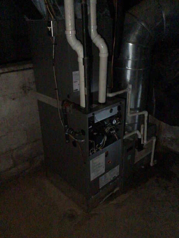 Performed scheduled 1st visit annual maintenance on 1-year-old HVAC system. Inspected and replaced 20x25x5 air filters in basement-installed furnace unit with PVC exhaust. Examined outdoor condensing unit mounted on concrete pad, confirming proper operation and condition of electrical connections. Documented system condition with photographs of both indoor and outdoor components.