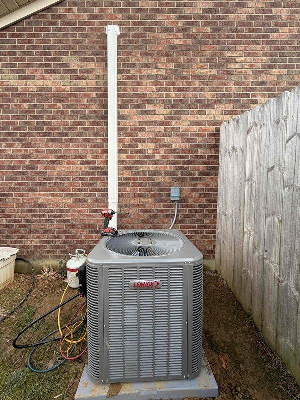 Completed installation of a new Lennox 2.5-ton, 15.5 SEER complete HVAC system, which included positioning the outdoor condensing unit on a concrete pad and connecting the necessary refrigerant lines and condensate drain. System startup verification confirmed proper operation with discharge air temperature at 76.4°F as measured at the supply register.