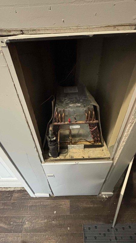 Conducted comprehensive HVAC replacement estimate for non-functioning A/C system at customer's residence. Inspection revealed aging outdoor unit with deteriorating concrete pad and electrical connections, along with dust-laden indoor evaporator coil showing signs of wear. Customer specifically requested replacement options only, declining repair alternatives.