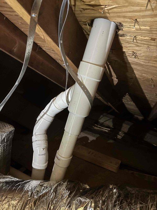 Installed furnace concentric kit requiring roof access to modify existing exhaust venting system. Properly sealed PVC pipe penetration with roofing cement to ensure weatherproof installation. Part has been ordered to complete the repair; system currently operational with green priority status.