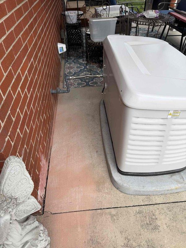 Successfully installed an 18 KW Generac standby generator on a concrete pad adjacent to the client's residence. Unit was properly positioned and secured on the exterior patio area, with all connections made according to manufacturer specifications. Generator was sold by Brookman in Owensboro.