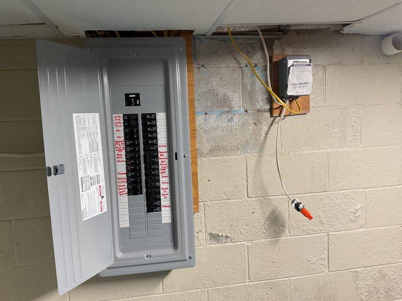 Conducted a comprehensive generator installation estimate at residential property. Inspected the existing electrical panel, which features multiple labeled circuit breakers that would need integration with a transfer switch. Evaluated the natural gas meter and supply line to determine appropriate connection points for the proposed generator system.