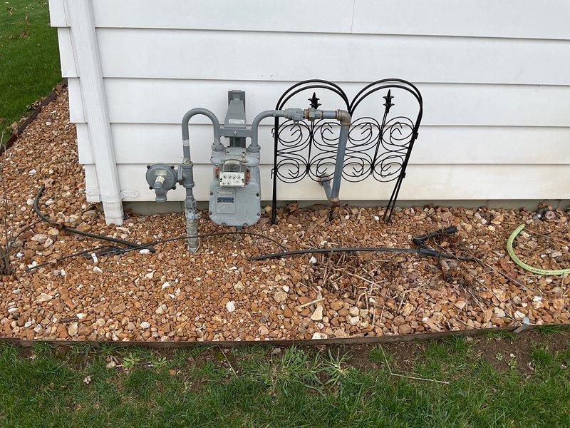 Conducted a comprehensive generator installation estimate at residential property. Inspected the existing electrical panel, which features multiple labeled circuit breakers that would need integration with a transfer switch. Evaluated the natural gas meter and supply line to determine appropriate connection points for the proposed generator system.