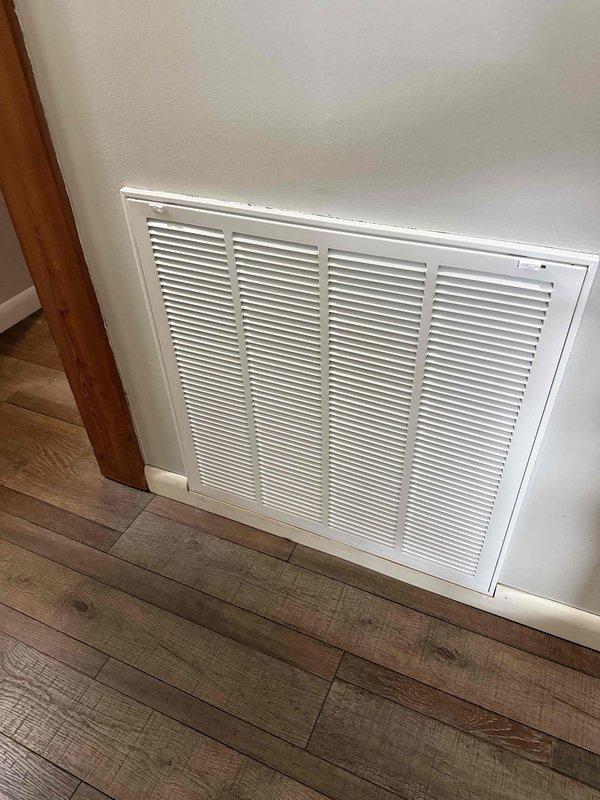 Successfully installed a complete 2.5 ton, 15.5 SEER Amana HVAC system in the utility closet of the residence, including proper connection of ductwork with reflective insulation and PVC ventilation piping. System includes new air return vent installed on interior wall with all components verified operational.