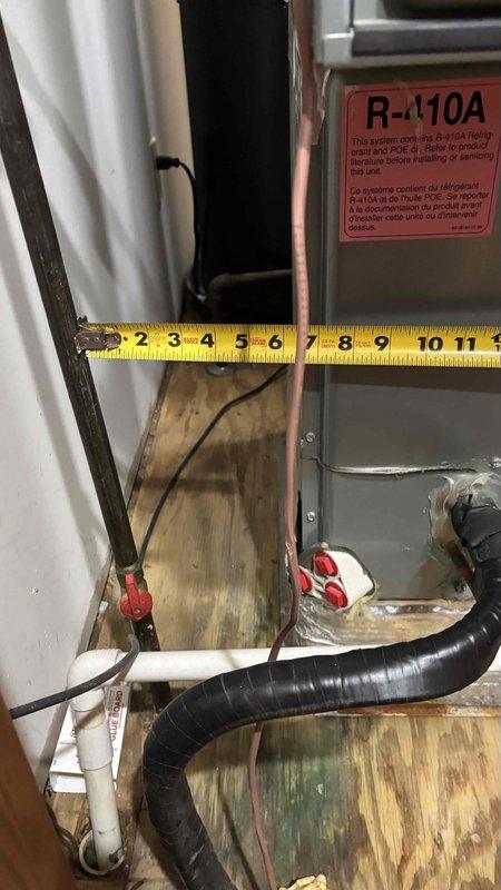 Conducted comprehensive HVAC system replacement assessment, focusing on an existing unit with prior AC repair history and functional furnace. Inspected current installation including ductwork, access panels, and R-410A refrigerant system components. Measurements were taken and documented to ensure proper sizing for the replacement equipment, with particular attention to existing connections and mounting requirements.