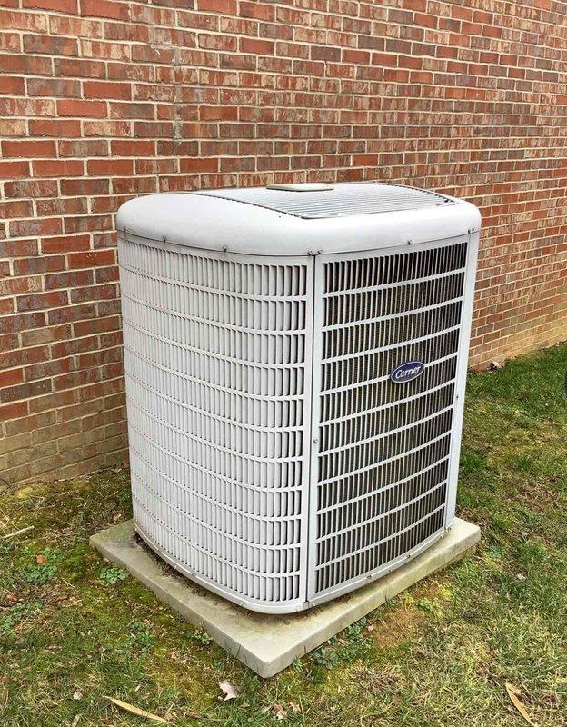 Performed Gold Level annual maintenance on a 14-year-old Carrier HVAC system. Inspected outdoor condenser unit (mounted on concrete pad against brick wall) and verified thermostat operation. Replaced 20x25x5 air filter as part of scheduled first visit service.