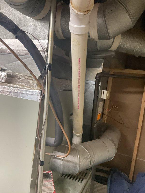 Replaced 15+ year old inoperative heating system with new XE 90 furnace installation in basement utility area. Complete system replacement included new ductwork connections, PVC venting, and integration with existing humidifier. Installation verified proper function of all components with comprehensive testing of the new heating system.