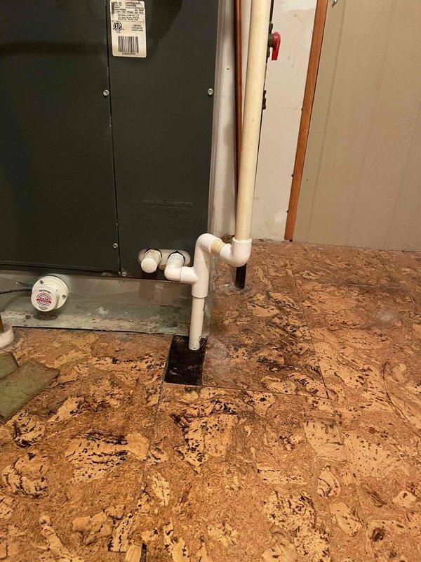 Responded to water leak concern where customer had exposed pipe with visible floor rot. Upon inspection of the 12-year-old system, identified leak in PVC condensate drain pipe where it transitions from the air handler into the crawl space. Replaced damaged section of drain line with proper grade and supports, ensuring correct installation to prevent future water damage.
