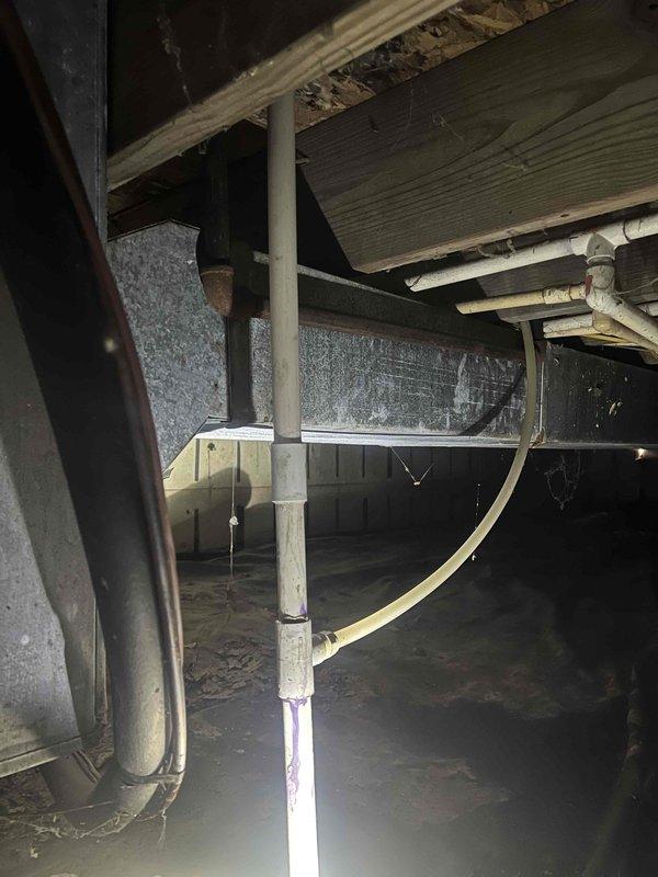 Responded to water leak concern where customer had exposed pipe with visible floor rot. Upon inspection of the 12-year-old system, identified leak in PVC condensate drain pipe where it transitions from the air handler into the crawl space. Replaced damaged section of drain line with proper grade and supports, ensuring correct installation to prevent future water damage.