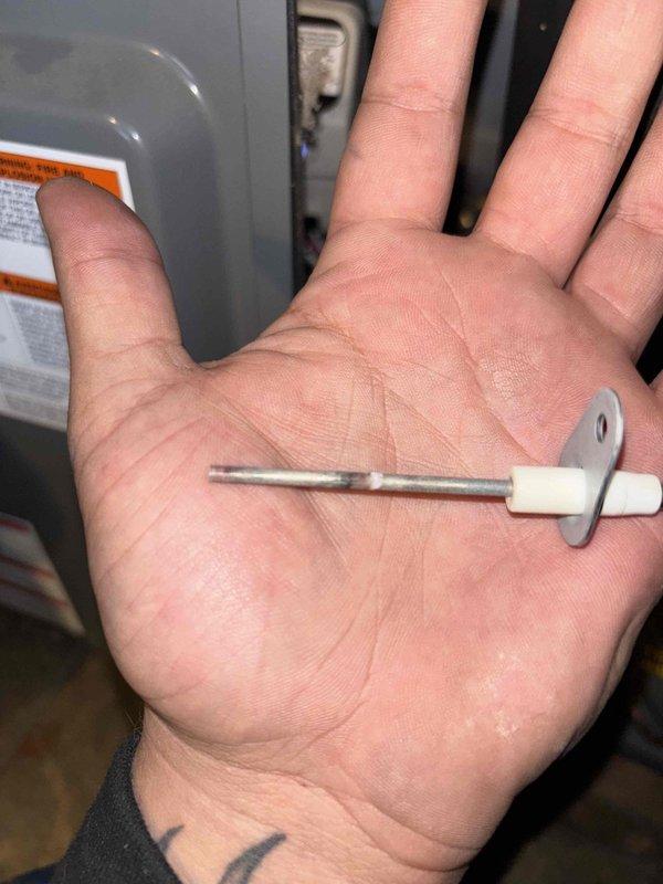 Responded to no heat complaint on 3-year-old system under home warranty. Diagnostic testing revealed faulty flame sensor causing system failure. Removed, cleaned, and reinstalled the sensor, restoring proper ignition and heat output. System now functioning correctly with home temperature rising from 63°F toward setpoint of 68°F.