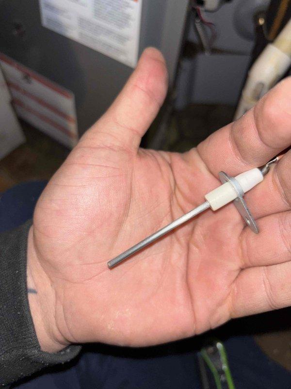 Responded to no heat complaint on 3-year-old system under home warranty. Diagnostic testing revealed faulty flame sensor causing system failure. Removed, cleaned, and reinstalled the sensor, restoring proper ignition and heat output. System now functioning correctly with home temperature rising from 63°F toward setpoint of 68°F.