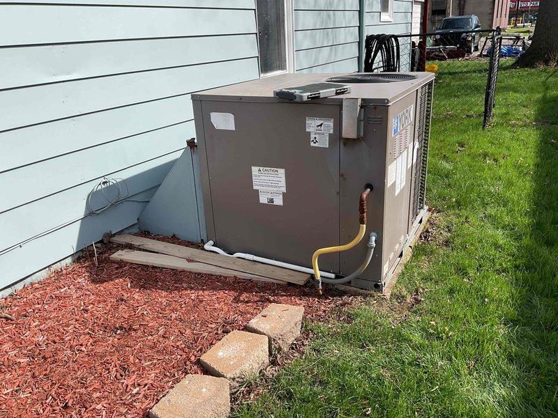 Conducted comprehensive assessment of existing packaged HVAC system with natural gas heat exchanger showing signs of failure. Unit is currently operational but approaching end of life cycle. Inspected exterior components and refrigerant lines, documented current installation conditions, and provided replacement options for complete system versus heat exchanger repair. Additionally discussed duct cleaning service as requested by homeowner.