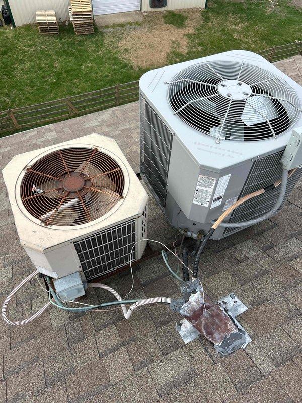 Conducted an estimate for replacement of an aging R22 system experiencing refrigerant leak. Visual inspection revealed two rooftop units with significant wear on the older beige unit, including visible rust on fan components and deteriorated condition compared to the newer gray unit. Recommended full system replacement due to R22 phase-out and current system's non-operational status.