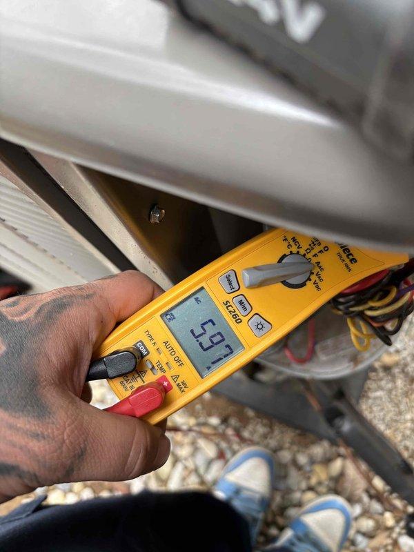 Conducted planned maintenance visit on HVAC system. Performed electrical inspection of control panel, checking all wire connections and components for proper installation. Verified system voltage readings using Fluke multimeter, confirming 4.97V at test points, which is within acceptable parameters. All connections were secure and no electrical issues were identified.