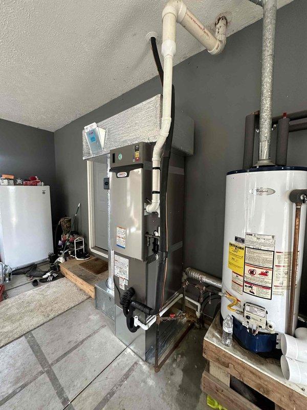 Successfully installed a complete 3-ton, 18 SEER system with 99% efficiency furnace in the mechanical room, including proper ventilation with PVC exhaust pipes and all necessary connections. System was properly mounted on wooden platforms with all electrical and plumbing components correctly installed according to manufacturer specifications.