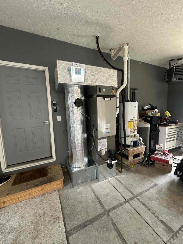 Successfully installed a complete 3-ton, 18 SEER system with 99% efficiency furnace in the mechanical room, including proper ventilation with PVC exhaust pipes and all necessary connections. System was properly mounted on wooden platforms with all electrical and plumbing components correctly installed according to manufacturer specifications.