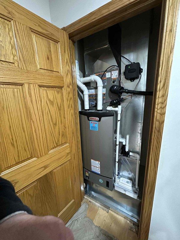 Completed installation of a Lennox 2-ton 15.5 SEER 97% efficiency HVAC system for the upstairs zone. Work included mounting the outdoor condensing unit on a concrete pad adjacent to an existing unit, and installing the indoor air handler/furnace in the utility closet with proper PVC venting connections. All components were properly secured, connected, and tested for optimal performance.