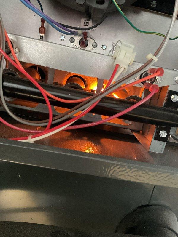 Diagnosed and repaired no-heat condition on 3-year-old furnace by inspecting the ignition system and verifying proper flame sensing. Restored normal operation by cleaning burner assembly and checking all electrical connections, confirming proper gas valve operation with visible blue flames and normal ignition sequence.