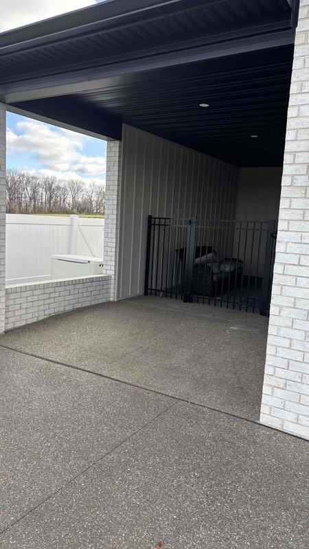 Conducted comprehensive site evaluation for potential HVAC installation in customer's shed structure. Assessed covered outdoor area with concrete flooring, examining structural elements and available space for optimal system placement. Customer seeking heating/cooling solutions for this auxiliary building; recommended appropriate HVAC options based on space requirements and environmental factors.
