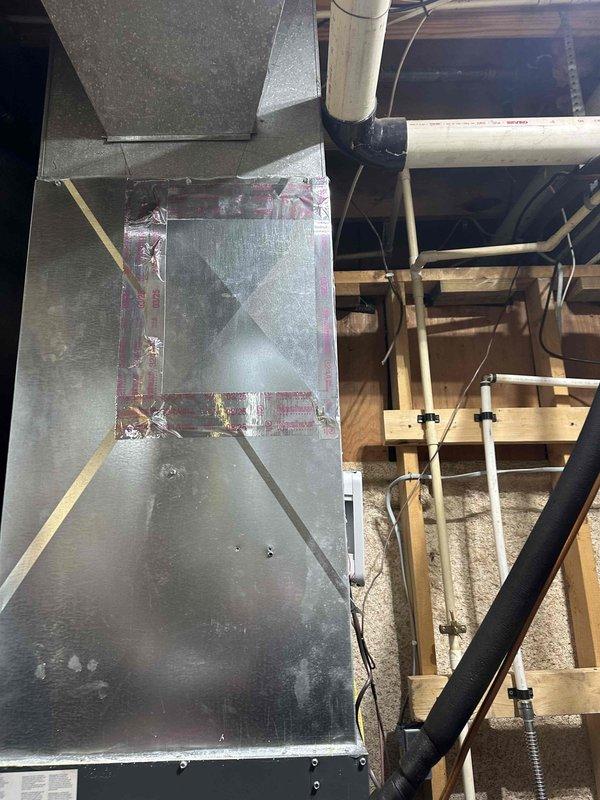 Conducted follow-up inspection of humidifier as requested from previous incomplete service visit. Examined HVAC ductwork system including metal junctions, seams and connections in ceiling/attic space. Inspected associated plumbing components including PVC pipes and insulation material mounted to wall framing studs with appropriate brackets and clips.