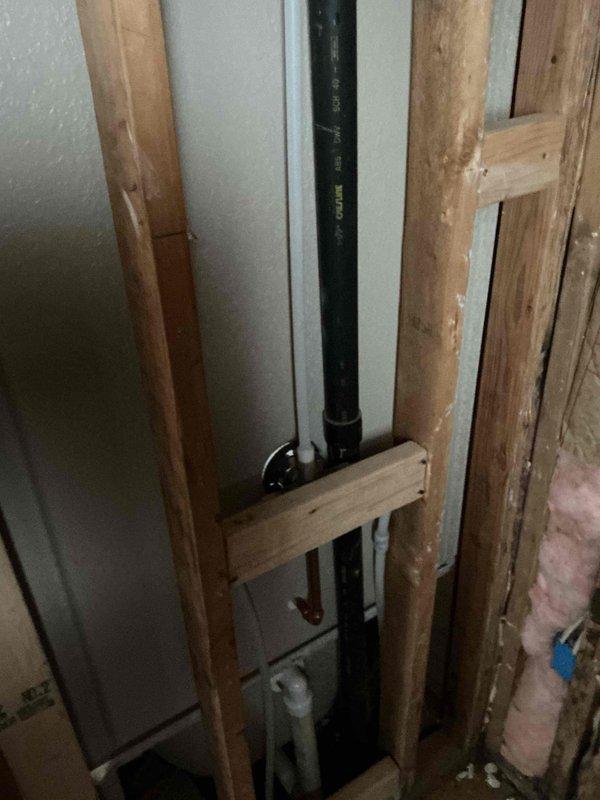 Successfully installed a fiberglass shower/tub enclosure in a bathroom under renovation. Properly mounted the unit within the wall framing and completed all necessary plumbing connections, including drain pipe and water supply lines secured with appropriate brackets. All components were installed according to code with proper alignment and secure fastening to ensure functionality.