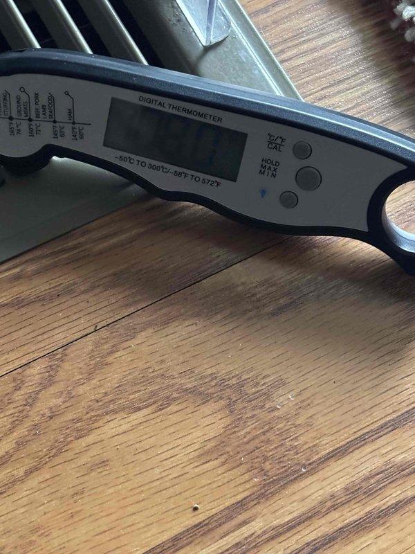 Performed planned maintenance on 9-year-old HVAC system. Conducted electrical measurements with Fluke 5440 multimeter showing 3808 reading and temperature verification with digital thermometer (-50°C to 300°C range). System functioning properly after service; customer has Gold Level maintenance agreement with next scheduled visit in 4/2025.