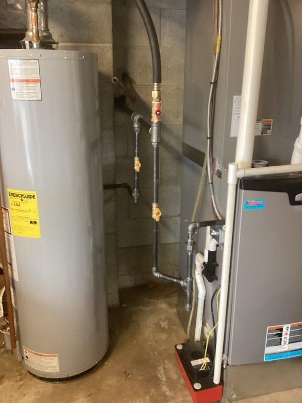 Successfully installed new water heater with proper connections to existing plumbing system in utility room. Completed all necessary piping work including PVC and copper line installation with appropriate valves and fittings. Performed thorough cleanup of work area after installation, removing all debris and construction materials from the crawl space.