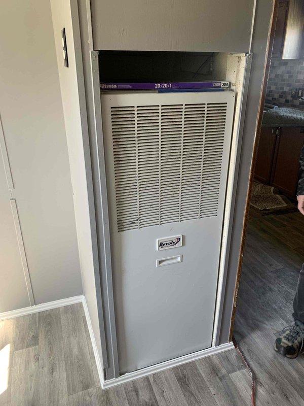 Conducted a replacement assessment of an aging HVAC system showing significant deterioration, including oxidized copper coils and worn internal components. Evaluated the current installation configuration in the enclosed space and documented the specifications needed for proper replacement. Recommended upgrading to a new energy-efficient unit with proper ventilation requirements.