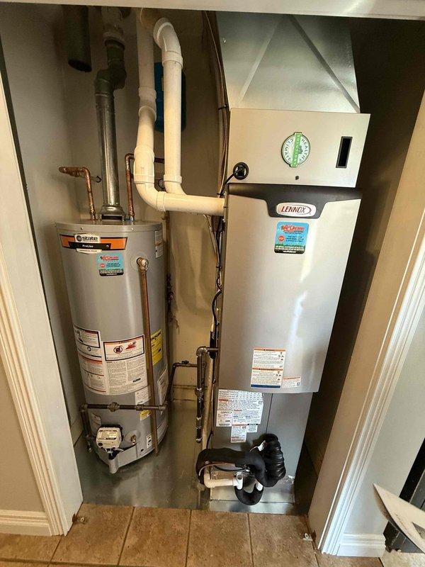 Completed installation of a 40-gallon short State gas water heater in utility closet. Properly connected copper supply lines and PVC venting, ensuring all connections were secure and leak-free. System was tested and is functioning at optimal performance alongside existing Lennox HVAC unit.