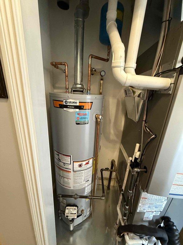 Completed installation of a 40-gallon short State gas water heater in utility closet. Properly connected copper supply lines and PVC venting, ensuring all connections were secure and leak-free. System was tested and is functioning at optimal performance alongside existing Lennox HVAC unit.