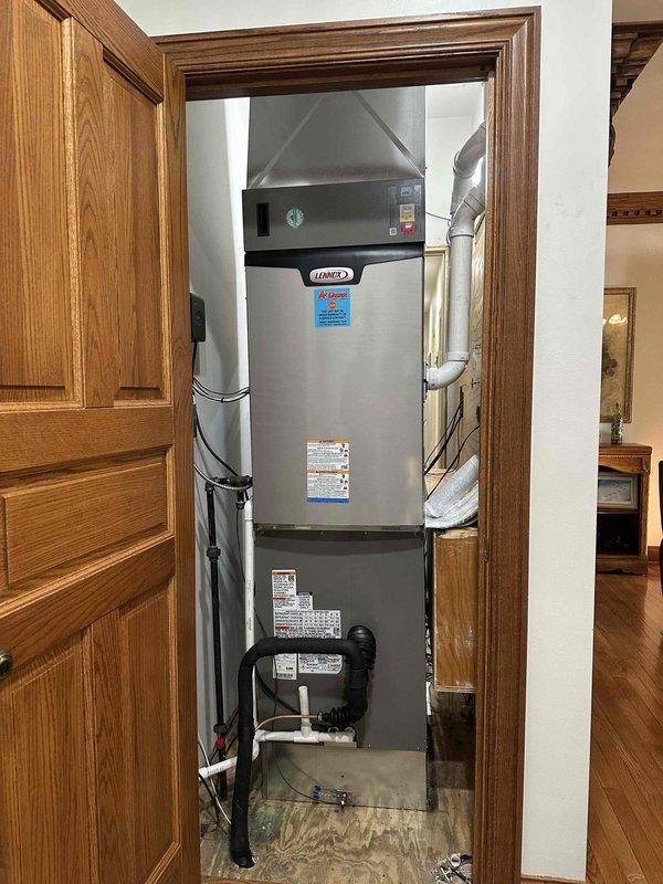 Completed installation of a GREEN 4-ton 18 SEER 99% efficient HVAC system with 3-zone capability. Work included mounting a new Lennox furnace in the utility closet with proper exhaust venting and ductwork connections, plus installation of the outdoor condenser unit on a protective pad with gravel surround. System was fully tested and is operating at optimal efficiency.