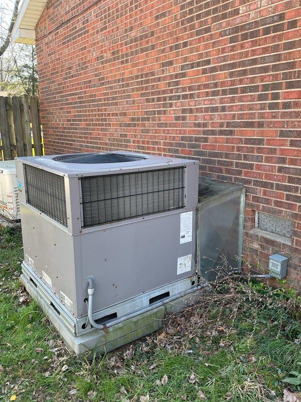 Conducted comprehensive assessment of existing outdoor HVAC unit showing significant weathering and age-related deterioration. Documented current installation conditions including copper line connections, electrical components, and concrete pad foundation for replacement quote. Recommended full system replacement with energy-efficient model to address performance concerns and improve home comfort.