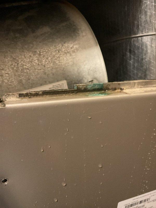 Completed planned maintenance on an 8-year-old HVAC system under Platinum Level service agreement (first annual visit). Replaced 24x24x4 filter and documented significant corrosion with moisture accumulation at panel seams, indicating potential refrigerant leakage. Inspected utility room configuration including water treatment systems and associated ductwork to ensure proper system operation.