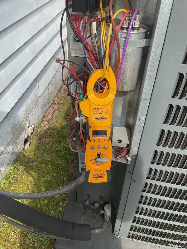 Completed monthly maintenance service on 4-year-old HVAC system under Gold Level Single System Home plan. Inspected and adjusted floor register vents throughout residence to ensure proper airflow distribution. Performed electrical diagnostic testing on outdoor condensing unit with clamp meter, recording amperage draw of 0.53, and inspected capacitor and wiring connections for proper function and safety compliance.