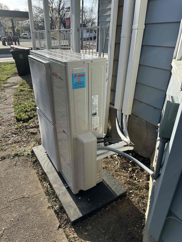 Successfully installed a 20K BTU dual-zone mini-split system with both 110V/220V electrical circuits at the customer's residence. The outdoor condenser unit was properly mounted on a concrete pad with protected refrigerant and electrical lines running to the building, and all interior wiring was completed with appropriate terminal connections and color-coded wiring to ensure optimal system functionality.
