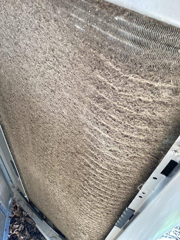 # HVAC Annual Maintenance Completed

Performed second annual preventive maintenance visit on one-year-old residential HVAC system. Removed and replaced heavily soiled 20x25x5 air filter showing significant accumulation of dust and debris, which had substantially reduced airflow capacity. The filter exhibited uniform discoloration and dense particulate buildup consistent with a full year of operation in dusty conditions.

Inspected outdoor condenser unit and confirmed proper operation. Completed standard maintenance procedures including system performance verification. Renewed annual maintenance agreement and collected payment as scheduled. System restored to optimal operating efficiency with new filtration in place.
