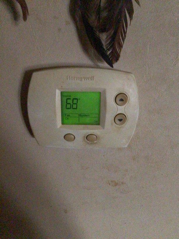 Responded to no-cool call on approximately 20-year-old system in mobile home. Customer reported unit would cool for approximately one hour before freezing up. Upon arrival, system was off and thawing as instructed. Performed diagnostic inspection and found evaporator coil heavily contaminated with thick dust and debris accumulation, severely restricting airflow. Reduced airflow caused coil temperature to drop below freezing point, resulting in ice formation and system shutdown. Explained that extensive contamination was root cause of freezing condition and that coil required professional cleaning or replacement to restore proper operation. Documented coil condition with photographs showing dense black buildup obscuring copper surfaces. Provided recommendations for system restoration and discussed options with property owner.