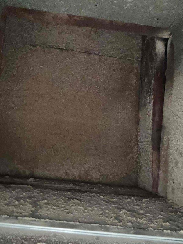 Completed planned maintenance on residential HVAC system, replacing 16x25x5 filter media in air handler unit. System has been on monthly maintenance schedule for five years, showing expected wear and aging on interior components with visible surface deterioration and discoloration on access panels. Verified proper filter fitment and confirmed unit operational status following filter replacement.