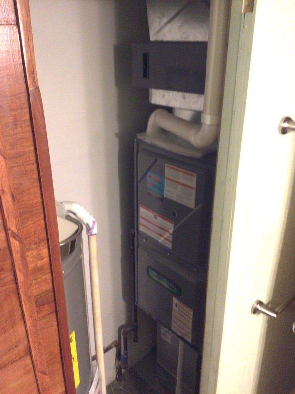 Completed planned maintenance on residential HVAC system, replacing 16x25x5 filter media in air handler unit. System has been on monthly maintenance schedule for five years, showing expected wear and aging on interior components with visible surface deterioration and discoloration on access panels. Verified proper filter fitment and confirmed unit operational status following filter replacement.