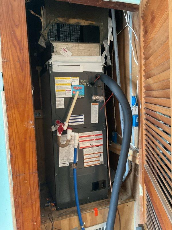 Responded to no heat call on 10-year-old heat pump system with airflow but no heating. Upon arrival, verified system was operating in emergency heat mode with thermostat set to 70°F and indoor temperature at 69°F. Performed diagnostic assessment of air handler unit and heat pump components, inspected Honeywell thermostat settings and confirmed proper mode selection. Evaluated refrigerant lines, condensate drainage system, and electrical connections at air handler. System found operating correctly on auxiliary heat strips with heat pump requiring further evaluation for heating capacity concerns.