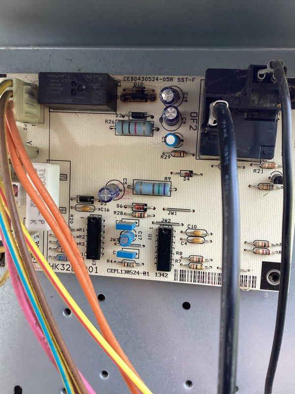 Responded to no cooling call on residential HVAC system over 10 years old with reported lack of airflow when fan was engaged. Upon arrival, performed diagnostic assessment of system controls and blower operation. Inspected main control board (CEBD430524-05M) and associated electrical components for proper function, examining relays, capacitors, and integrated circuits for signs of failure. Verified all wire connections and terminals for secure contact and proper voltage. Evaluated blower motor circuit and associated wiring harness for continuity and operational status. System exhibited complete failure of air circulation with no airflow through supply vents despite thermostat fan command, indicating potential control board malfunction or blower motor failure preventing normal operation.