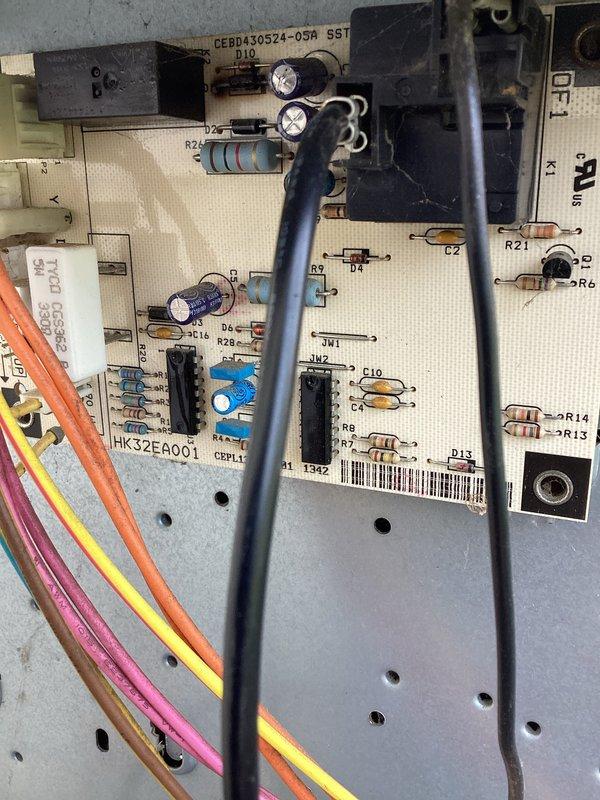Responded to no cooling call on residential HVAC system over 10 years old with reported lack of airflow when fan was engaged. Upon arrival, performed diagnostic assessment of system controls and blower operation. Inspected main control board (CEBD430524-05M) and associated electrical components for proper function, examining relays, capacitors, and integrated circuits for signs of failure. Verified all wire connections and terminals for secure contact and proper voltage. Evaluated blower motor circuit and associated wiring harness for continuity and operational status. System exhibited complete failure of air circulation with no airflow through supply vents despite thermostat fan command, indicating potential control board malfunction or blower motor failure preventing normal operation.