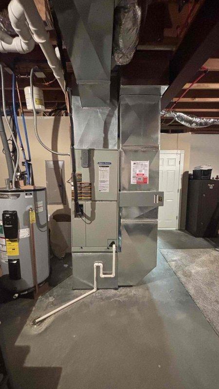 Conducted comprehensive HVAC system replacement estimate for aging residential furnace and air conditioning system that has been operating marginally for several years. Evaluated existing basement-installed gas furnace with associated ductwork and outdoor condensing unit mounted on exterior brick wall, documenting current equipment specifications, electrical connections, and venting configurations. Provided homeowner with detailed replacement options and recommendations for complete system upgrade to improve efficiency and reliability.