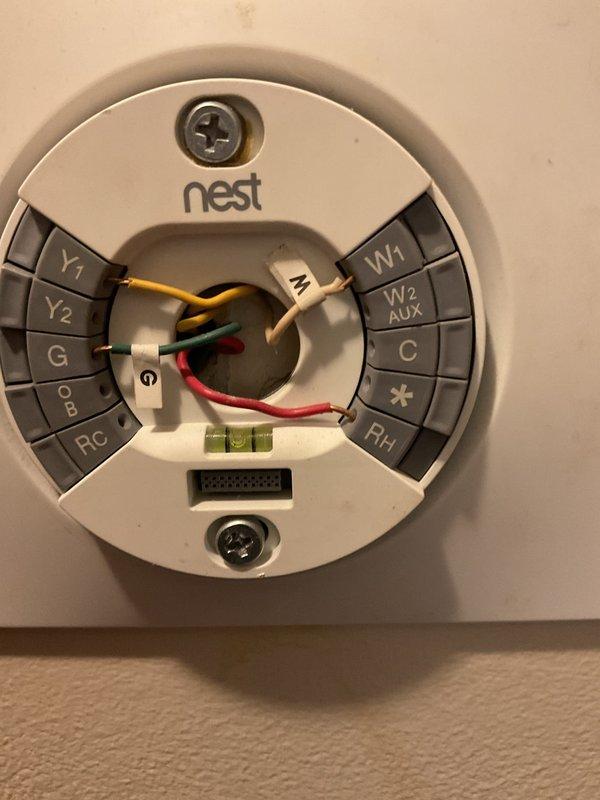 Completed comprehensive HVAC system evaluation for full replacement estimate at residential property. Assessed existing outdoor condensing unit positioned on concrete pad against brick exterior and inspected Nest thermostat with multi-stage wiring configuration including Y1, Y2, G, O/B, RC, W1, W2/AUX, C, and RH terminals. Documented current system condition and provided detailed replacement options with financing information based on previous recommendation from another contractor that complete system replacement was necessary.