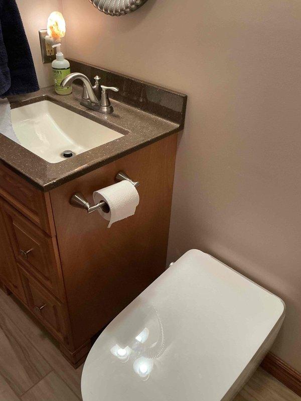 Completed installation of two toilets in residential bathroom. Performed associated electrical work to accommodate bidet functionality, including installation of electrical outlet near toilet fixture. Verified proper water supply connections, secure mounting, and tested flush mechanisms for optimal performance. Electrical components installed to code specifications to support bidet operation.
