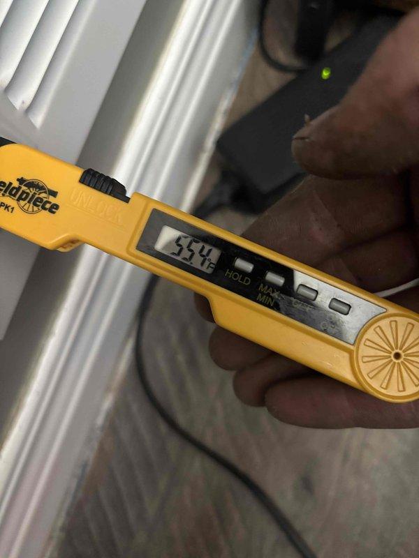 # HVAC Install - Complete System

Successfully completed full system installation including outdoor condensing unit and associated components. Performed comprehensive system commissioning and diagnostics using professional-grade instrumentation. Utilized digital manifold gauge to verify refrigerant pressures and system operating parameters, confirming proper charge levels with readings of 123.0 PSI and 256 PSI on respective service ports. Connected yellow, red, and blue refrigerant hoses to outdoor unit for accurate pressure testing and system evaluation.

Conducted temperature verification at supply ductwork, recording 55.4°F discharge air temperature to confirm proper cooling performance and system efficiency. All measurements taken with calibrated digital instruments to ensure accuracy and compliance with manufacturer specifications. System operating within normal parameters for optimal performance and energy efficiency.