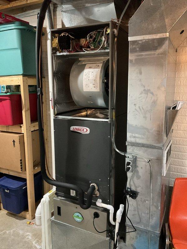 Completed Platinum Level maintenance on a one-year-old Lennox furnace system with integrated humidifier. Performed comprehensive inspection of all internal components including electrical connections, control board, circuit breaker, and wiring harness. Inspected and serviced cylindrical drum-style humidifier unit, verified proper operation and water panel condition. Checked blower compartment assembly and gas line connections for proper installation and safety. Replaced 20x25x5 air filter and verified all access panels secured properly. All components found operating within normal parameters with no deficiencies noted during this first annual maintenance visit.