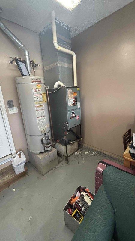 Completed comprehensive HVAC replacement estimate for non-functional residential heating system. Assessed existing furnace unit located in basement utility room, documented current equipment specifications, evaluated electrical panel capacity and circuit availability, and photographed existing installation including furnace, water heater proximity, venting configuration, and available workspace. Provided homeowner with complete system replacement options and recommendations based on equipment age, condition, and household heating requirements.